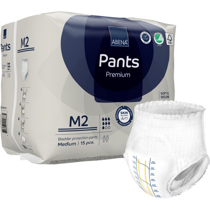 A pack of ABENA Pants Premium M from Abena Re-Seller GmbH contains 15 pieces. A disposable pant is pictured outside the packaging, featuring measurement lines emphasizing its high absorbency.