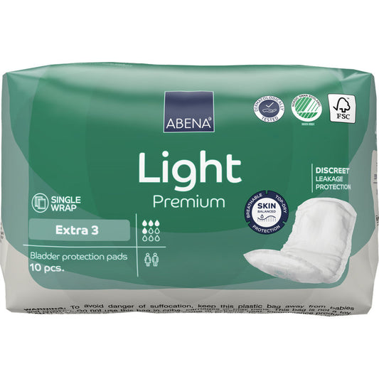 Eine grün-weiße Packung ABENA Light Extra 3, Premium von Abena Re-Seller GmbH (10 Paare) hebt zusätzlichen Schutz, Produktmerkmale und ein Pad-Foto auf der rechten Seite hervor; hochwertige Einlagen in Einzelverpackung.