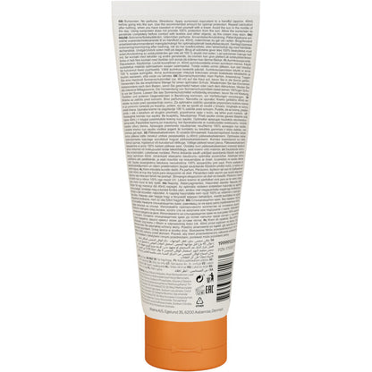 Close-up of the back of a Bambo Nature sunscreen 200ml SPF30 tube from Abena Re-Seller GmbH with information and instructions for sensitive skin in various languages, as well as symbols and a barcode. The sunscreen is color and fragrance-free.