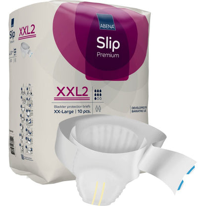 A pack of ABENA Slip Premium from Abena Re-Seller GmbH is displayed, with a partially unpacked slip in front. The purple and white pack emphasizes the size XX-Large, 10 pieces, and reliable incontinence care.