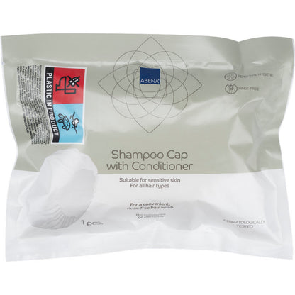 A sealed package from Abena Re-Seller GmbH contains a white shampoo cap (ø 32 cm), dermatologically tested, suitable for sensitive skin and all hair types - ideal for use without rinsing (washing hair without water).