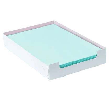 A light blue AMPri Dental crepe cover tray filter paper with the dimensions 18 x 28 cm lies neatly in an open white tray from AMPri Handelsgesellschaft mbH. The tray has slightly raised sides and a flat bottom.