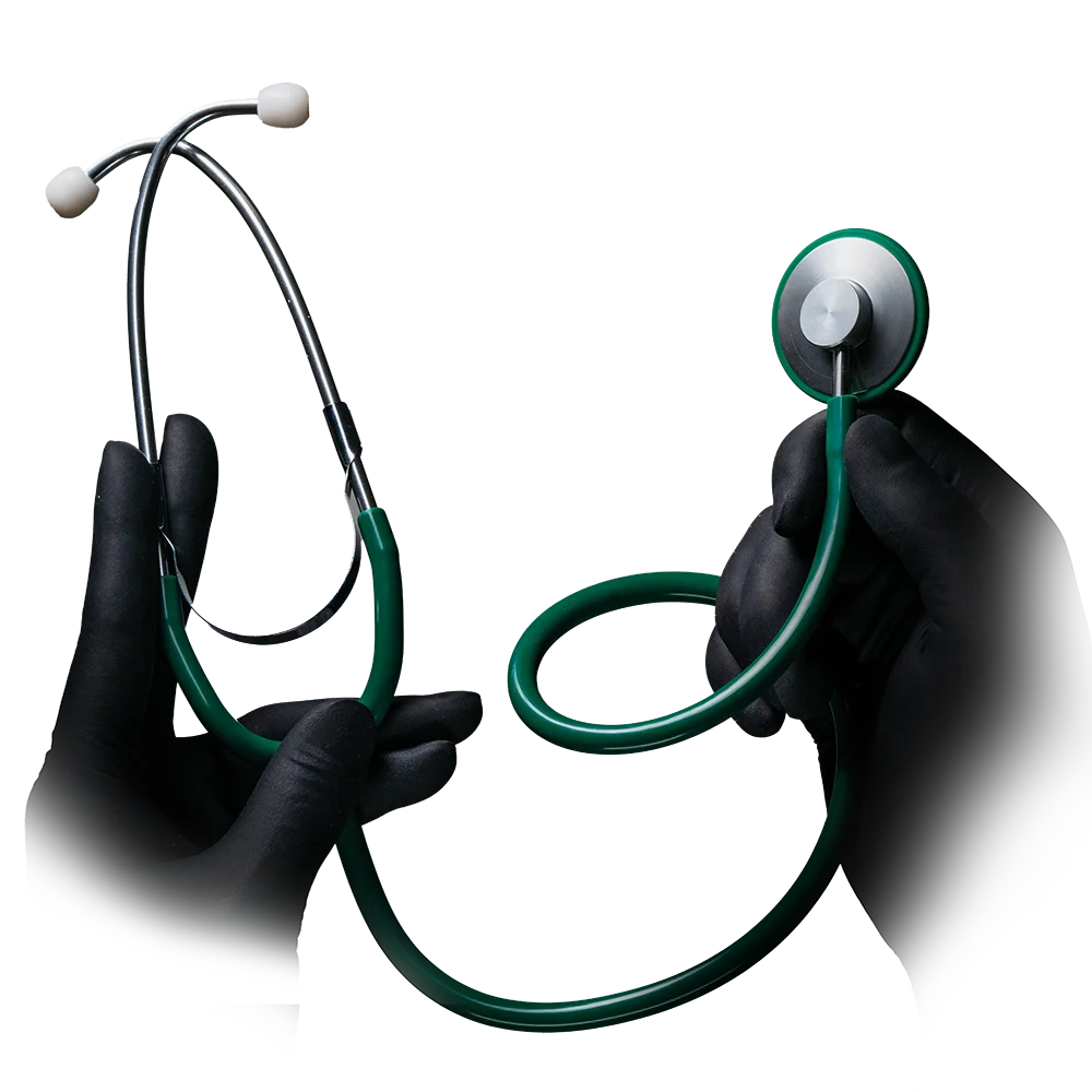 Two gloved hands hold a green AMPri MED-COMFORT PVC flathead stethoscope from AMPri Handelsgesellschaft mbH against a white background. The left hand holds the ear tips, while the right hand grasps the diaphragm – an indispensable instrument in hospitals.