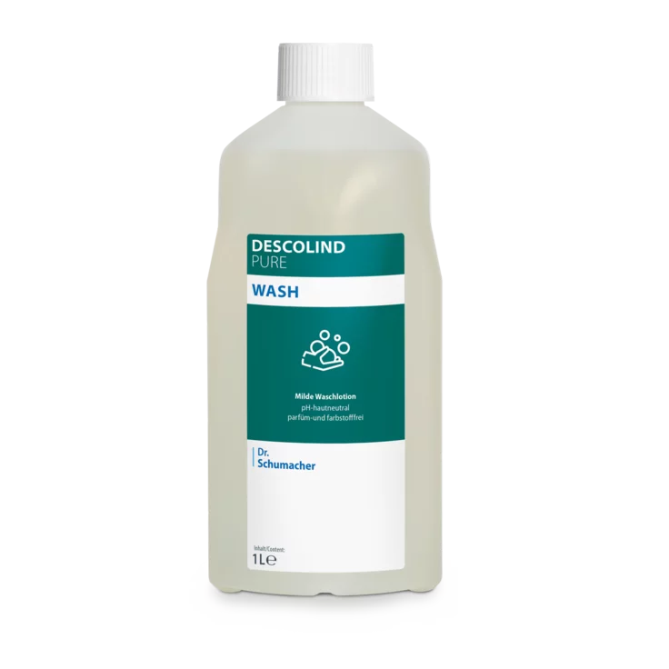 Dr. Schumacher Descolind Pure Wash Waschlotion der Dr. Schumacher GmbH in einer 1-Liter-Kunststoffflasche, pH-neutral und parfümfrei für empfindliche Haut, mit weißer Kappe und grün-weißem Etikett mit Produktinformation und Handwaschsymbol.