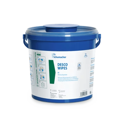 A blue 3 l nonwoven cloth dispenser made of plastic by Dr. Schumacher GmbH with a lid and handles, labeled "DESCO WIPES". The label contains hygienic cleaning instructions, icons, and information about the disinfectant cloth product.