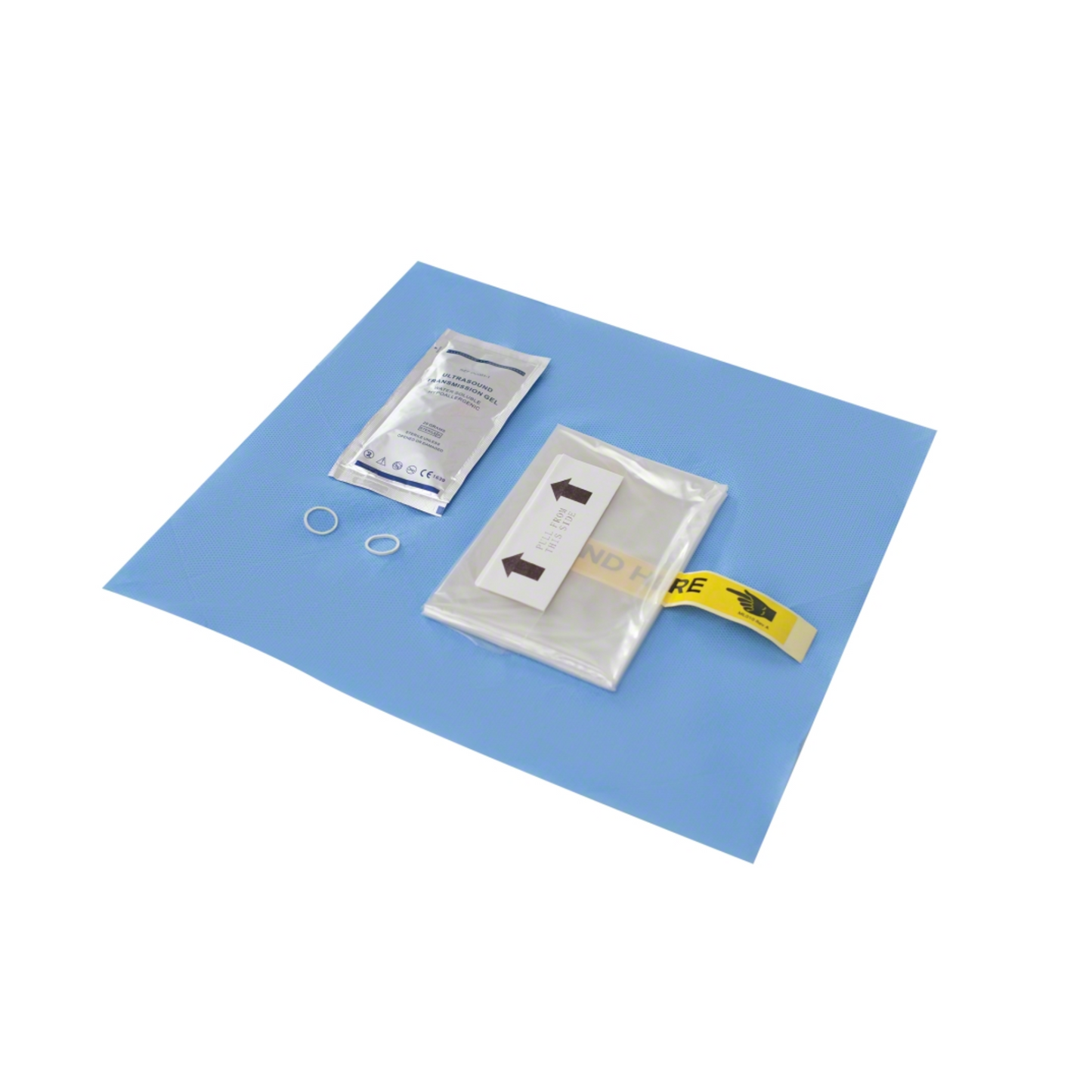 The B. Braun EZCOVER® transducer cover for sterile ultrasound application, 15x30 cm | 1 piece from B. Braun Deutschland GmbH & Co. KG is presented on a blue surgical drape. The kit includes a sealed package with a round item, a strip labeled with arrows, and two small white round bands to ensure process safety.