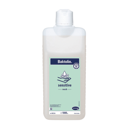 A 1000 ml bottle of Hartmann Baktolin® sensitive wash lotion, equipped with a blue-white label and a graphic indicating its suitability for sensitive skin.