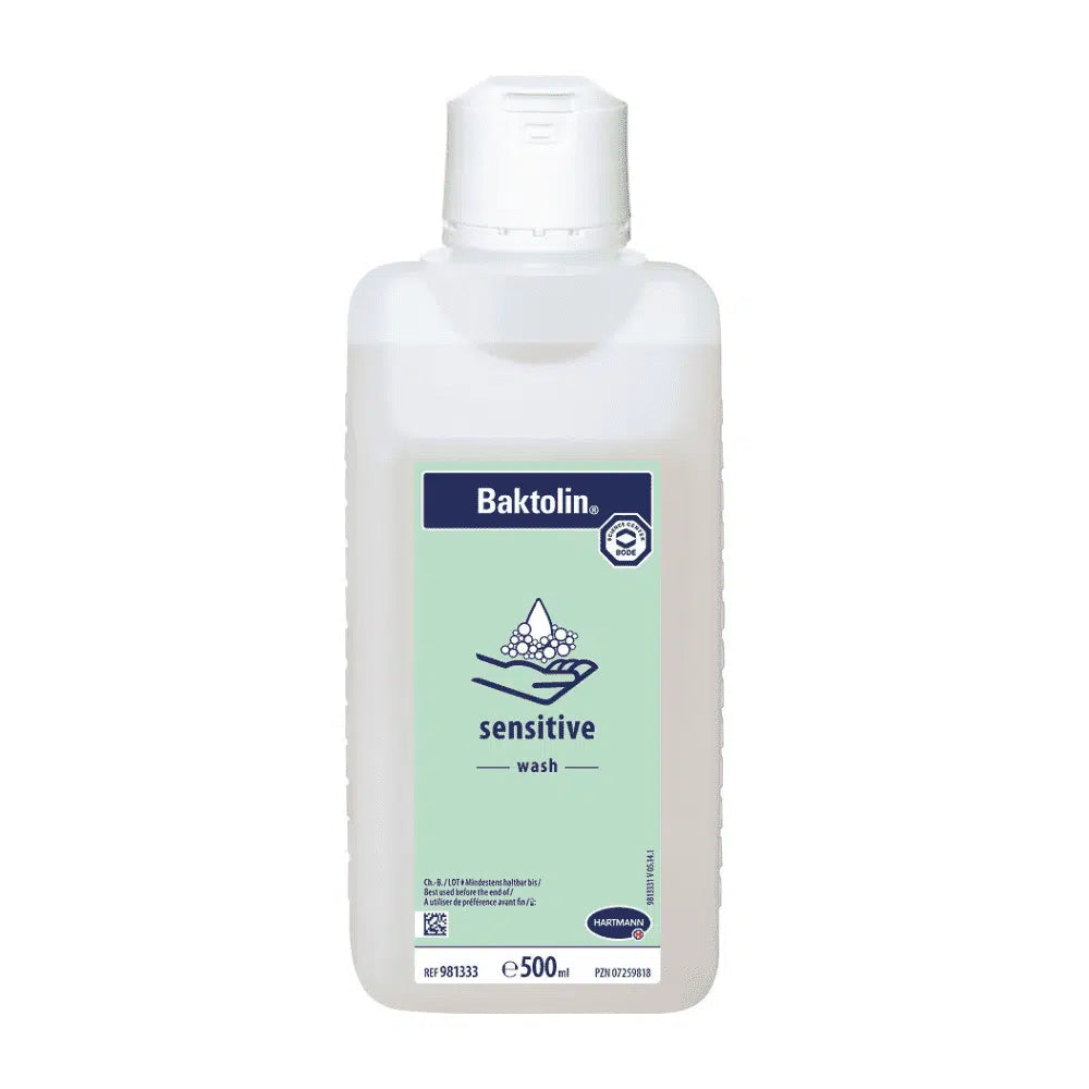 A 500 ml bottle of Hartmann Baktolin® sensitive wash lotion with a white-blue-green label featuring the Paul Hartmann AG logo and information in multiple languages. The bottle has a white flip-top cap.