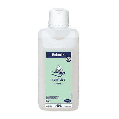 A 500 ml bottle of Hartmann Baktolin® sensitive wash lotion with a white-blue-green label featuring the Paul Hartmann AG logo and information in multiple languages. The bottle has a white flip-top cap.