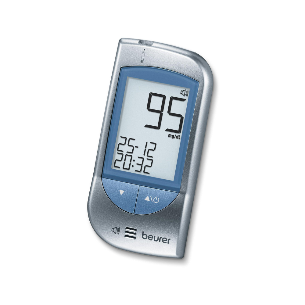 A Beurer blood glucose meter GL 34 mg/dL displays a value of 95 mg/dL on the screen. Below the glucose value, the date 25-12 and the time 20:32 are displayed. The device has a silver-blue casing with the brand name "Beurer GmbH" at the bottom, ideal for diabetics.