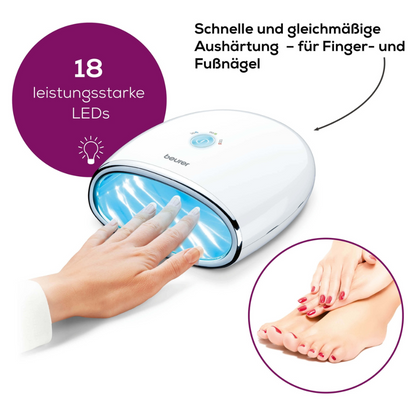 A person places their hand in a Beurer MP 48 LED/UV nail dryer | Package (1 piece) from Beurer GmbH with blue light. The lamp has 18 powerful LEDs and a reflective base plate. A German text explains that the lamp cures fingernails and toenails quickly and evenly. An inset image shows a pair of manicured hands and feet.