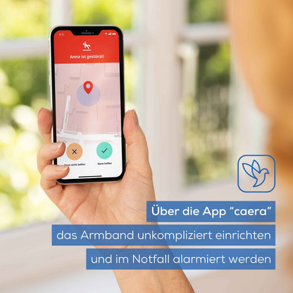 A hand holds a smartphone with an emergency alert on the "caera" app, next to the Beurer emergency bracelet EC 70 SafePlus (discontinued item, Beurer GmbH), highlighting the setup and activation of automatic fall detection for safety.
