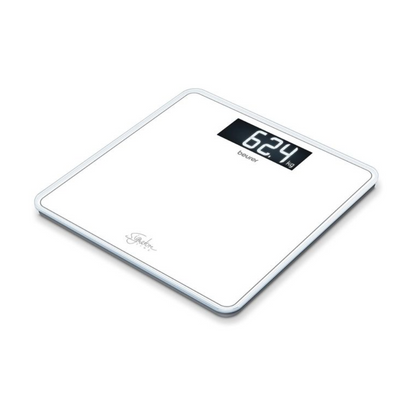 A white digital personal scale, the Beurer GS 400 body scale SignatureLine from Beurer GmbH, displays a weight of 62.4 kg. This glass scale SignatureLine model features a sleek rectangular design with rounded edges and a black rectangular screen for display. The word "Beurer" is visible below the display on the screen, and the scale has a load capacity of 200 kg.