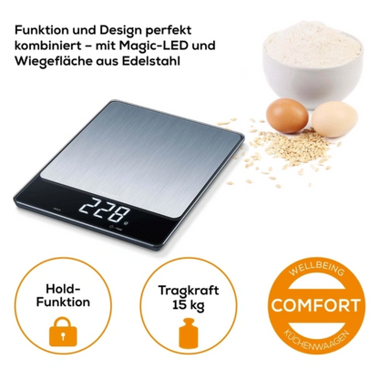 The Beurer KS 34 XL stainless steel kitchen scale (discontinued item, 1 piece) from Beurer GmbH shows "228g" on the LED display. Thanks to a 15 kg capacity and hold function, it is ideal for flour, eggs, and oatmeal.