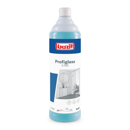A 1-liter bottle of Buzil Profiglass G 522 ready-to-use glass and surface cleaner ensures streak-free shine. The translucent bottle with the blue liquid is labeled with a white label displaying the brand logo of BUZIL-WERK Wagner GmbH & Co. KG, the product name, and images of a bathroom mirror and a sink, making it perfect for combating greasy residues.