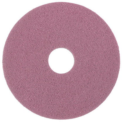 The Diversey Twister Pad Pink for vinyl floors by Diversey Deutschland GmbH & Co. OHG is a round, textured pink cleaning pad with a central hole, viewed from above, ideal for cleaning or polishing vinyl floors.