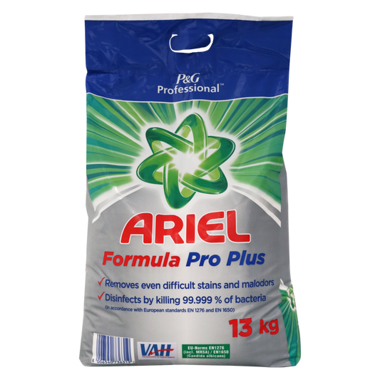 Ein 13-kg-Sack Dr. Schnell ARIEL Formula Pro PLUS Desinfektions-Vollwaschmittel von DR.SCHNELL GmbH & Co. KGaA entfernt Flecken, tötet 99,999% der Bakterien ab und sorgt für professionelle Wäschehygiene. Blau-silbernes Design mit grünem Stern-Logo und rotem Text.