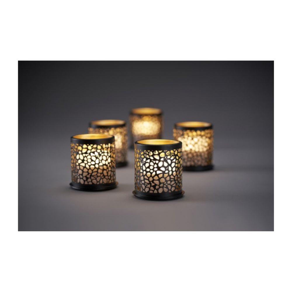 Eight colorful Duni GmbH Multicolour LED Mini candles shine through grid-shaped candle holders and cast magical shadows on a simple surface for creative lighting in a dim ambiance.