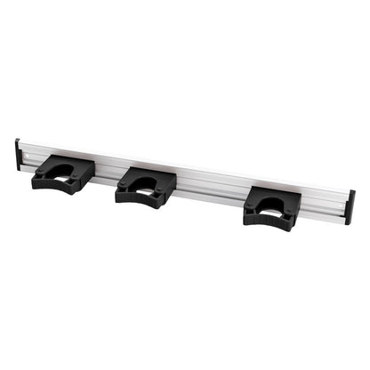The Haug Bürsten KG ALU DEVICE STRIP, 3 HANDLE HOLDERS, 510x55mm is a wall-mounted organizer with three black plastic holders for practical storage of tools or equipment.