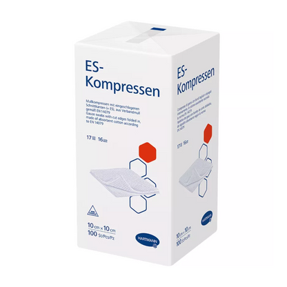 A white box of Hartmann ES compresses 17-ply, 16-fold, non-sterile from Paul Hartmann AG shows product information and compression folding diagrams. The box is labeled in red and blue and indicates the size as 10 cm.
