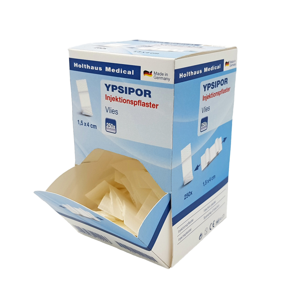 A rectangular box of Holthaus Ypsipor injection plasters from Holthaus Medical GmbH & Co. KG with the inscription "Made in Germany". The box is predominantly light blue and white, measures 1.5 x 4 cm, contains 250 fleece plasters with absorbent pads, and is depicted with an open top flap revealing the contents.