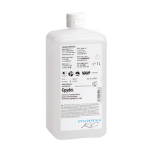 Weiße 1-Liter-Kunststoffflasche mit Flip-Cap und weißem Etikett mit schwarzer und blauer Schrift, Produktinformation, Symbolen und der Marke "Johannes Kiehl KG". Das Produkt "Kiehl Opydes Hygienische Händedesinfektion" sorgt für eine effektive Keimreduktion.