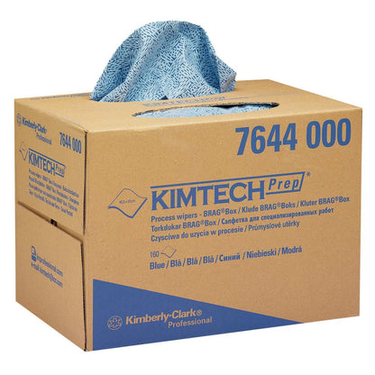 A blue patterned Kimtech® process wipe is dispensed from a brown Kimberly-Clark GmbH BRAG™ Box (1 box x 160 wipes). The box is labeled with product information and is ideal for industrial cleaning.