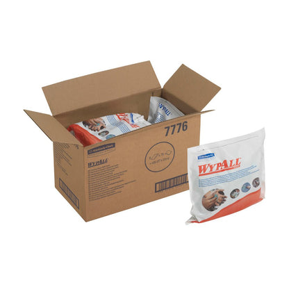 An open box labeled "WypAll" from Kimberly-Clark GmbH contains several sealed packs of WypAll® Wipes - Green (6 bags x 75 sheets). The outside of a pack features branding and images of hands using the green cleaning wipes.