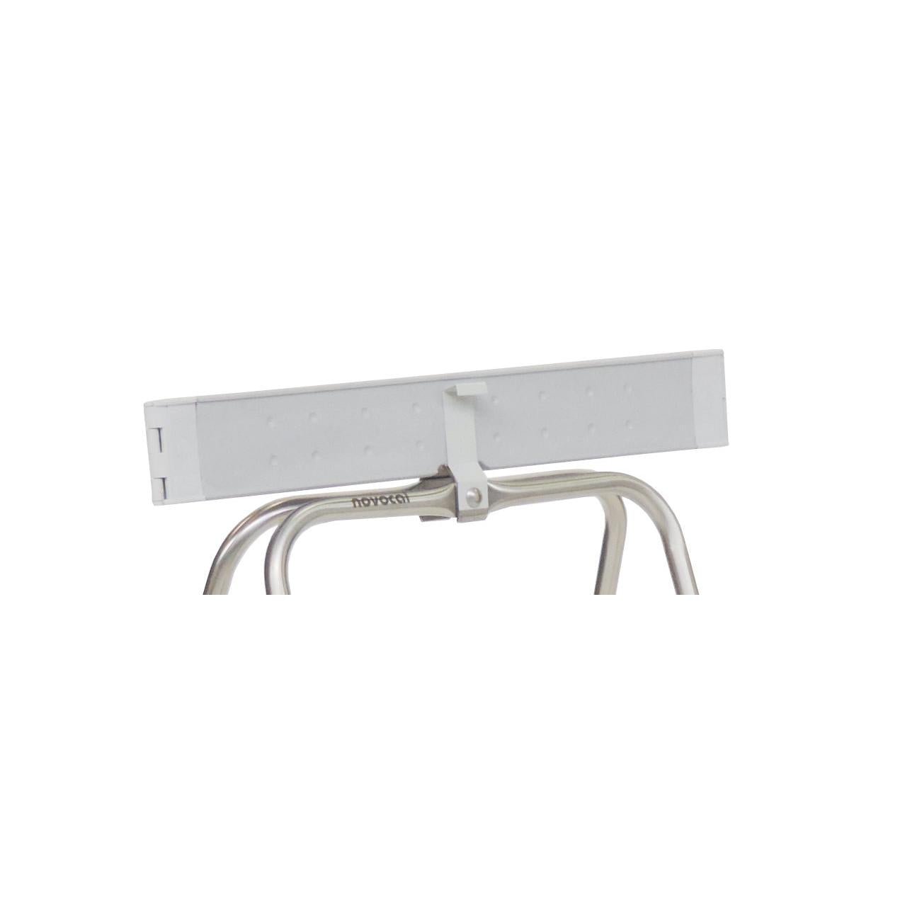 A close-up of a metal eyelash curler with a rectangular white eyelash pad, reflecting the precision of the Novocal clamping springs 1 set = 2 pieces for the clamping ring of the Novocal S 70 L waste collector, against a plain white background.