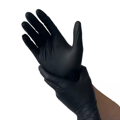 A person wearing black Kingfa powder-free nitrile gloves adjusts the glove on their other hand. These gloves are both latex-free and powder-free and are set against a plain white background.