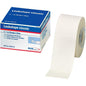 A roll of Leukotape Sport Tape Classic (3.75 cm x 10 m, white) from BSN Medical GmbH for sports injuries is partially unrolled; the packaging shows the product name, size, and brand.