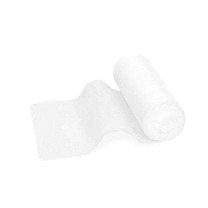 A roll of Meditrade ABE® Last elastic fixation bandage – various sizes, partially unrolled, lying on a plain white background. The paper is soft and has an elastic fixation bandage texture.