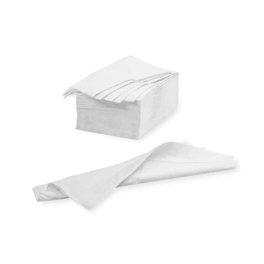 A stack of folded white Meditrade wipes—39 x 30 cm | carton (20 packs) from Meditrade GmbH is shown against a plain white background. One wipe is unfolded and lies in front of the stack, showing its full size and highlighting its high-quality cellulose composition.
