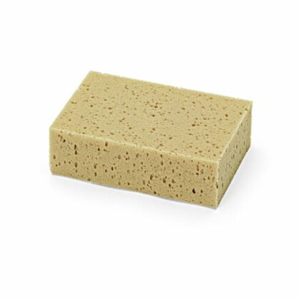 Rectangular light brown Nölle professional universal sponge with a porous, soft surface, lying on a white background.