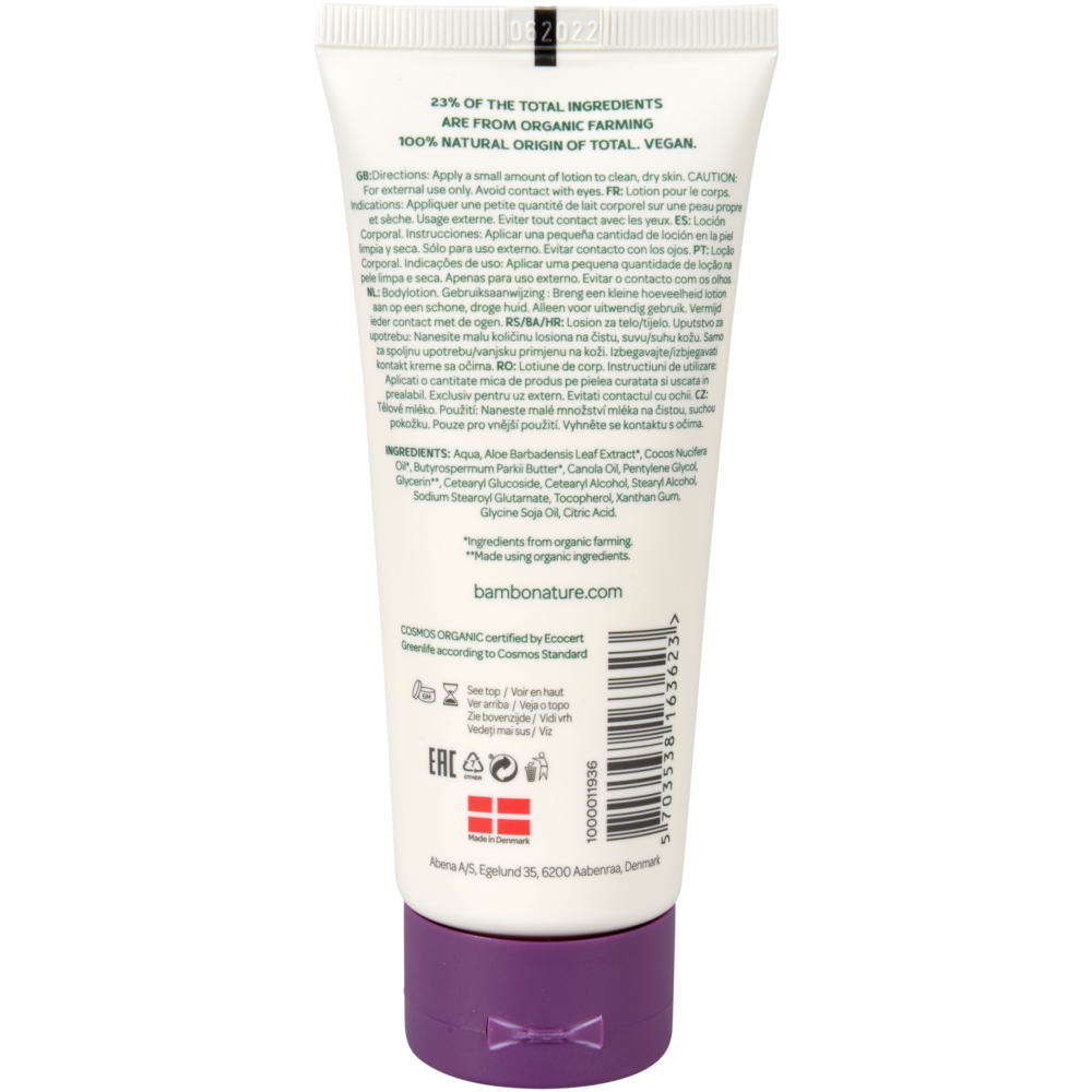 A white tube of Bambo Nature body lotion (100 ml, color and fragrance-free) from Abena Re-Seller GmbH with information on sensitive skin, hypoallergenic details, usage instructions, ingredients, certifications, barcode, and website on the back label. Package: 6 pieces.