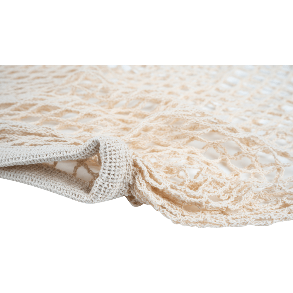 Close-up of a beige ENA Living shopping net from Abena Re-Seller GmbH - loosely woven, reusable net, ideal for eco-friendly shopping; available in a box with 24 packs.