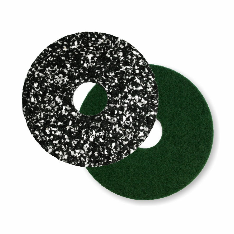 Two round floor pads from Arcora International GmbH, including the Arcora Pu-Pad Orbital 17" with a special green back (pack of 5), are shown overlapping - a black pad with white speckles and a solid green pad on a white background.
