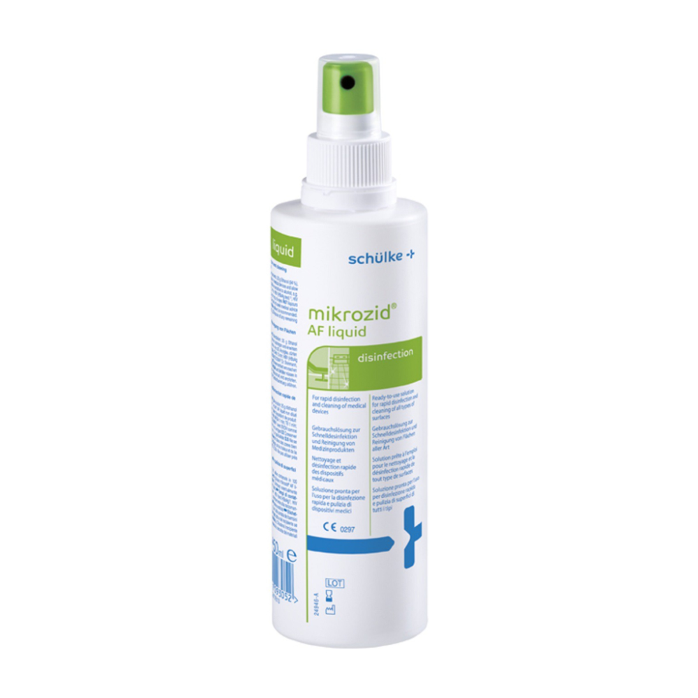 A white spray bottle labeled “Schülke Mikrozid® AF liquid” for disinfection with green-blue text and a green spray nozzle. Symbols and text indicate medical use.
