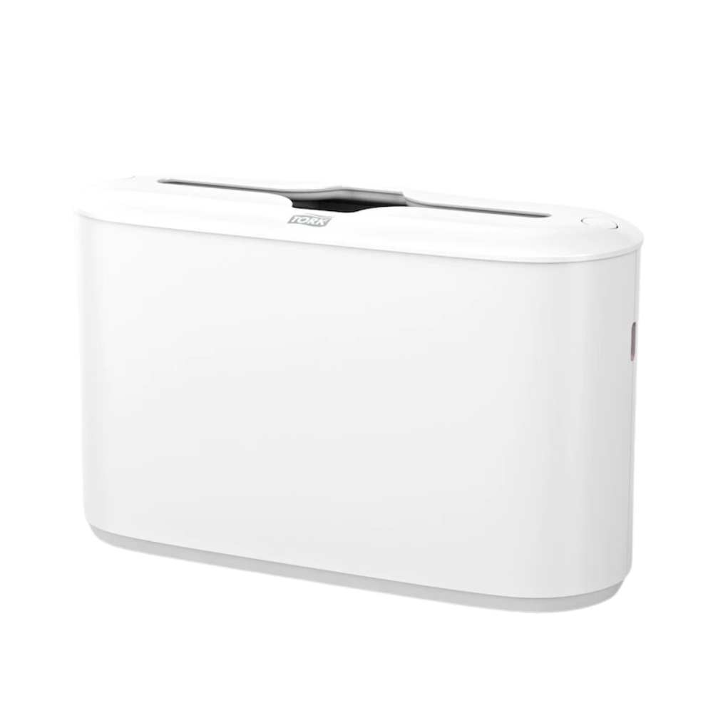 This elegant, rectangular electronic device from TORK – Essity Professional Hygiene Germany GmbH, known as the Tork Xpress® 552200 Tabletop Dispenser for Multifold Hand Towels Elevation H2, features a sleek white finish with Tork Xpress® technology. It has a slot on top and a button on the side, and its minimalist Elevation design with smooth edges ensures it elegantly complements any modern space.