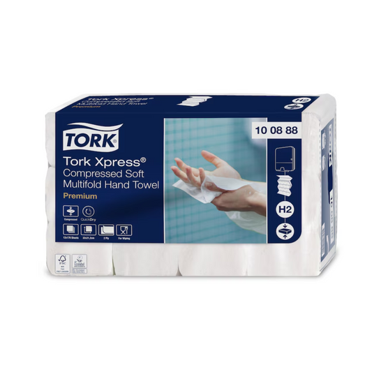 Paket mit Tork Xpress® Komprimierte Weiche Multifold-Handtücher Premium H2 2-lagig. Das Paket ist weiß und blau mit einem Bild, das eine Hand zeigt, die eines der Handtücher benutzt, was seine Premiumqualität unterstreicht.