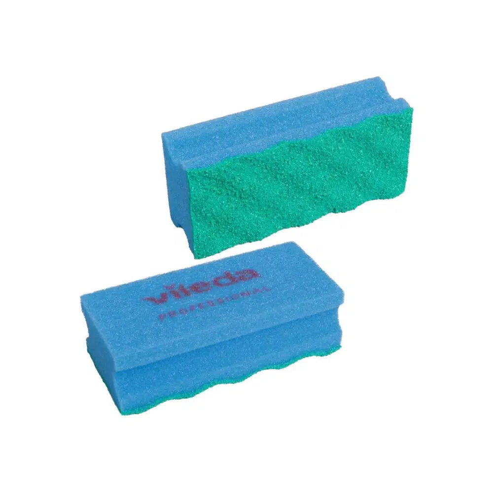 Depicted are two rectangular Vileda PUR Active SpongeProfi cleaning sponges, featuring a blue body with a wavy green scrubbing surface made of polyurethane. The upper sponge has the word "Vileda" in red on one side. These sponges from Vileda GmbH are elegantly arranged against a flawlessly white background.