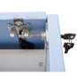Close-up of a Novocal central lock for all Novocal drawers, with two keys in the lock on a light blue metal drawer. The visible locking bar and hinge make it ideal for securely locking your cabinet.