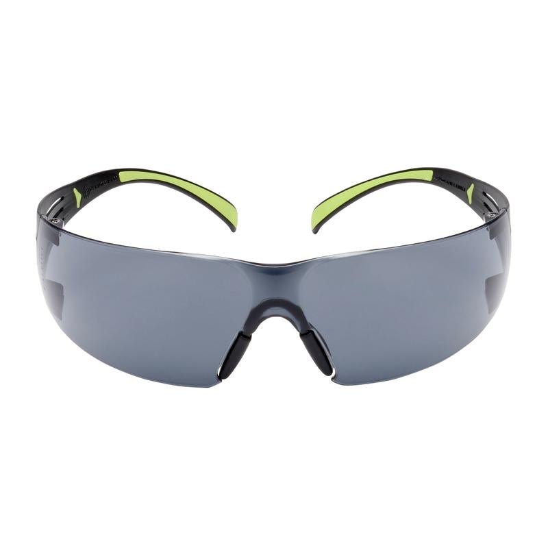 The 3M™ SecureFit™ Safety Glasses 400 from 3M Deutschland GmbH feature dark-tinted, wraparound lenses and black frames with green accents on the temples against a white background.