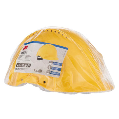 A yellow 3M™ G3000C Uvicator safety helmet from 3M Deutschland GmbH is in a transparent plastic package with a front label featuring product information, a helmet image, and safety certifications.