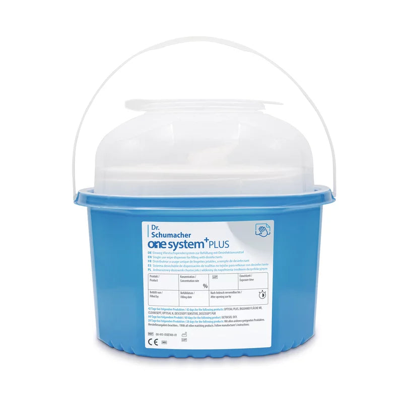 A blue plastic container from Dr. Schumacher GmbH with the label "One System Basic" contains disinfectant wipes. This disposable nonwoven wipe dispensing system supports effective hygiene measures, with detailed product information on the label.